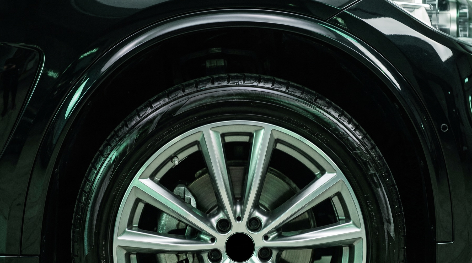 After: the same wheel gleaming clean with a deep black dressed tyre