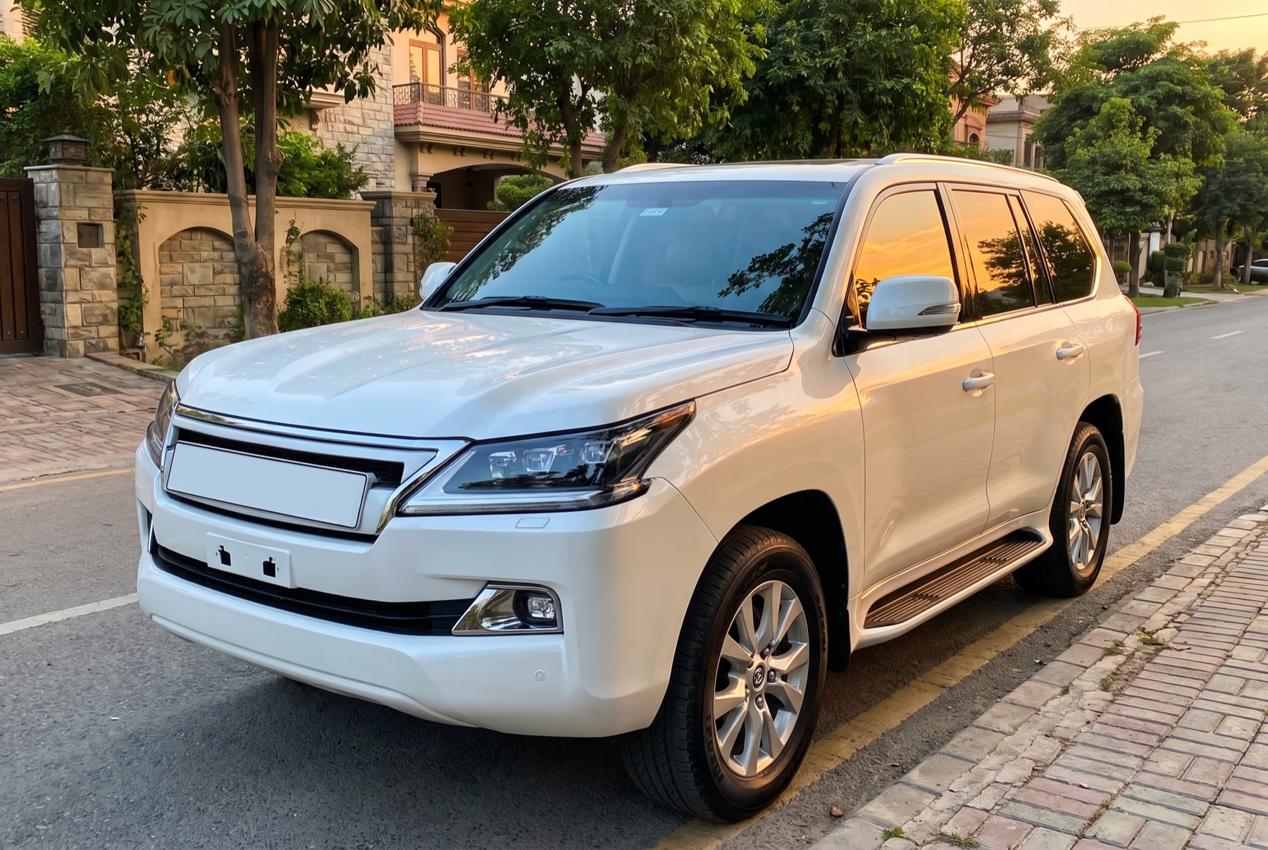 Freshly detailed white SUV parked on a tree-lined street at golden hour